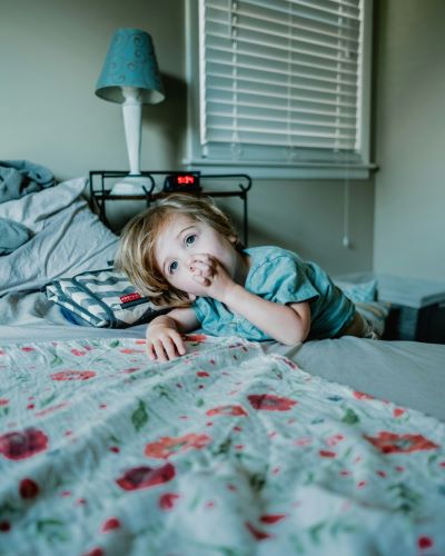 young child on a bed