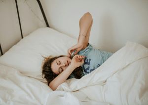 Young girl asleep in bed